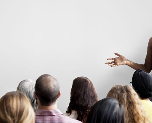 woman teaching employees about cybersecurity
