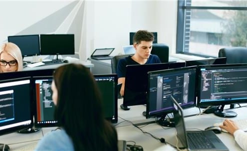 Business co-workers working at desks